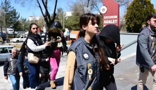 Erzurum'da fuhuş operasyonu kapsamında gözaltına alınan şüpheliler ve kurtarılan kadınlar.